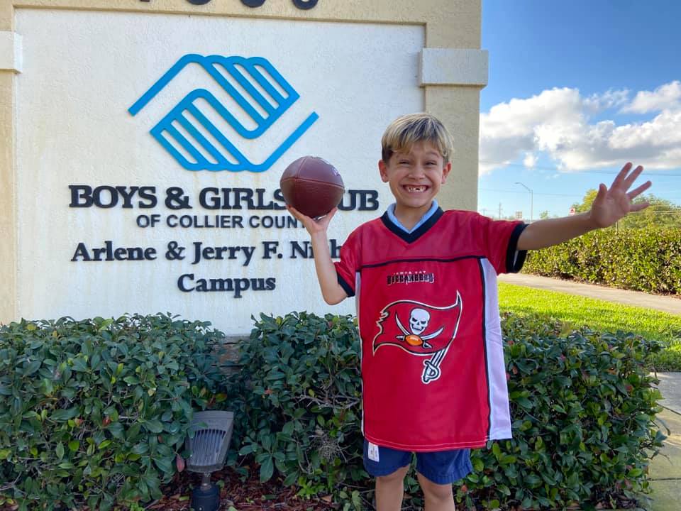 Kid with a football in his hand