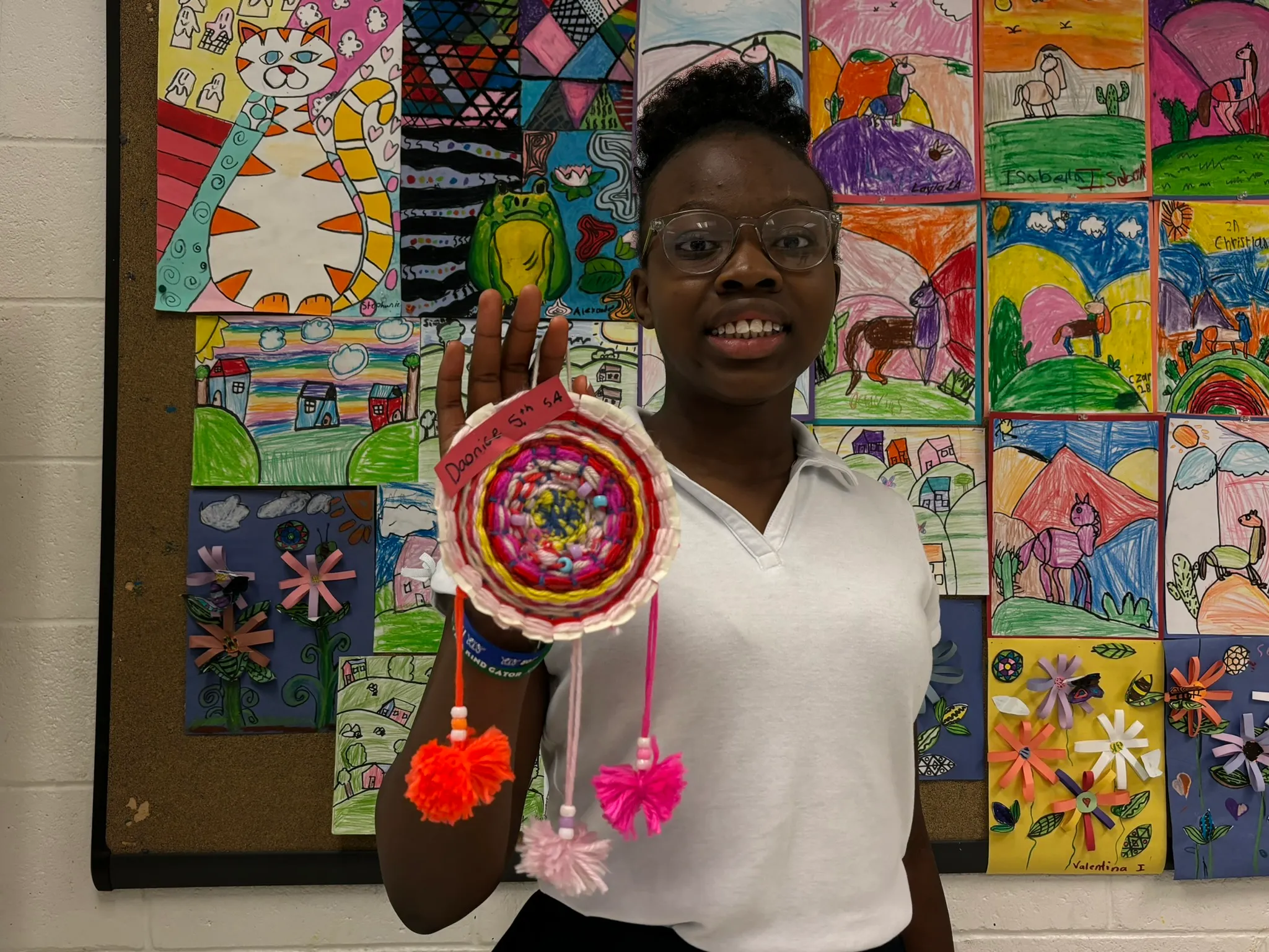 Daonice showing art she has made